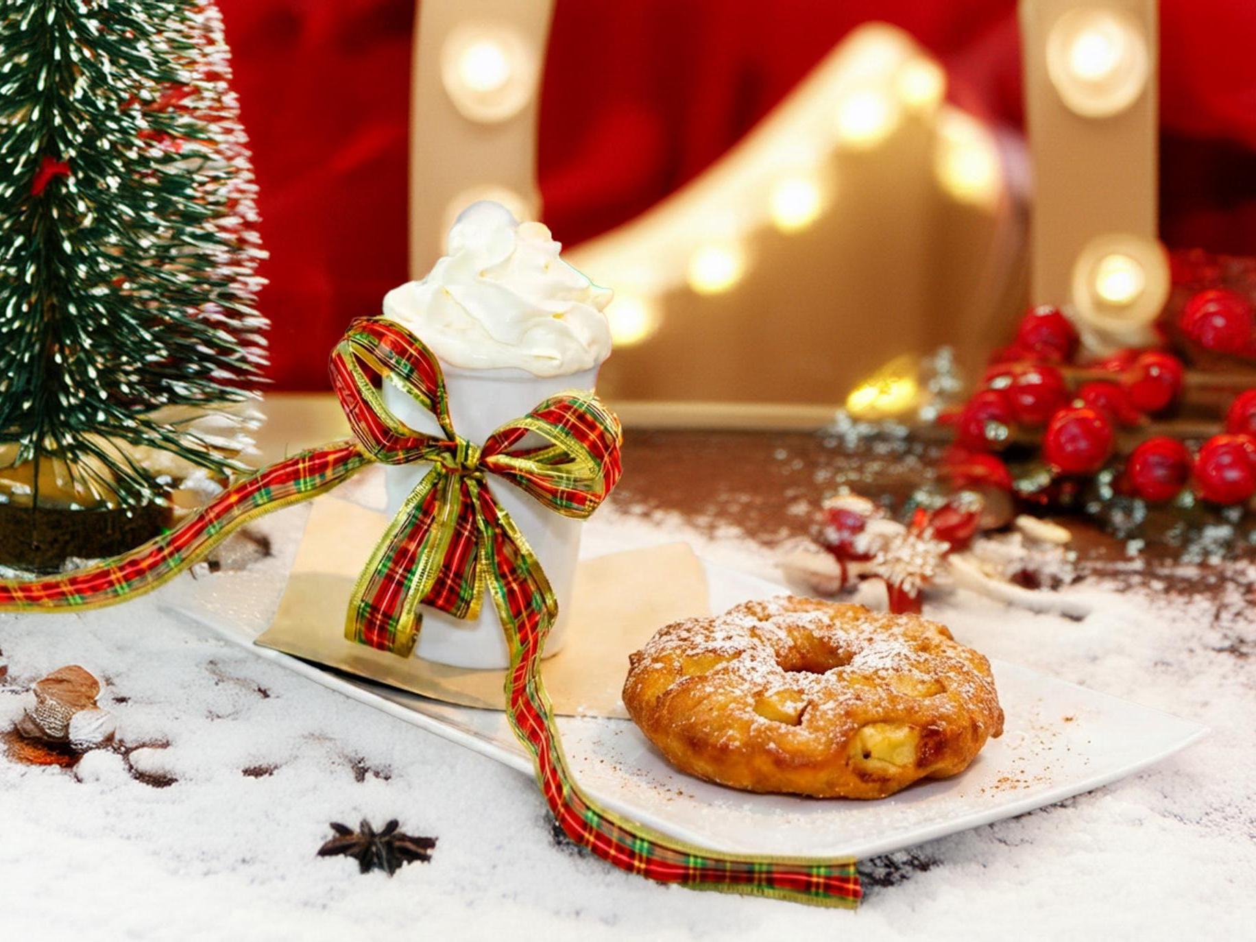 Christmas Treat with hot chocolate, whipped cream, marshmallows, and an apple beignet.